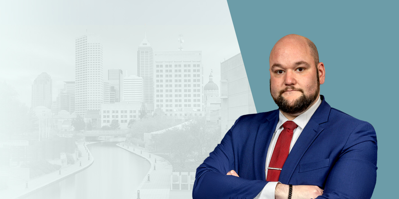 Picture of Eric Doyle with the buildings of Indianapolis in the background